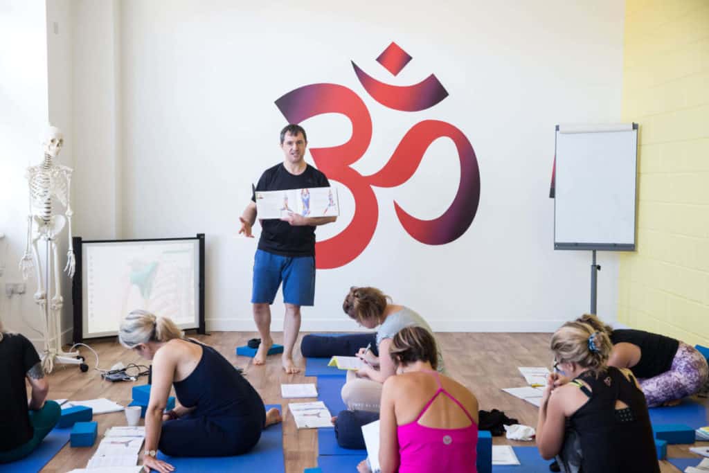 Learning yoga philosophy at yoga teacher training