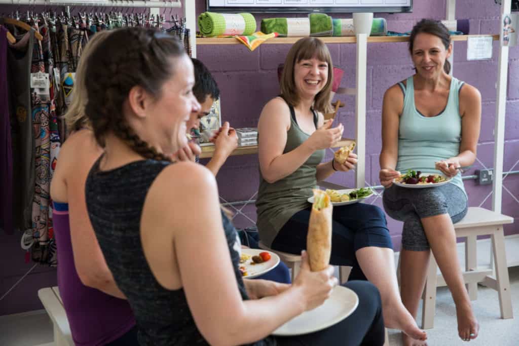 yoga students eating  healthy lunch