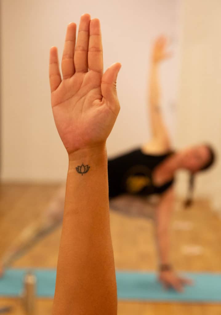 A hand reaching up in a yoga pose in bristol yoga studio Yogafurie
