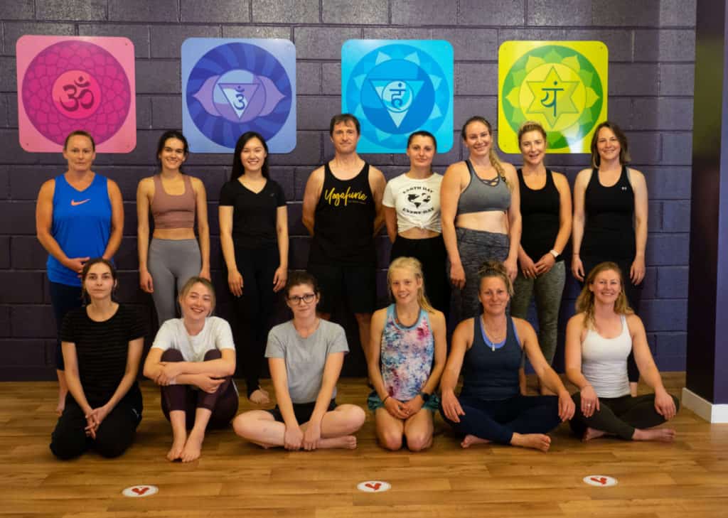 the yoga teacher training sangha (or community) in bristol, posing happily for a picture